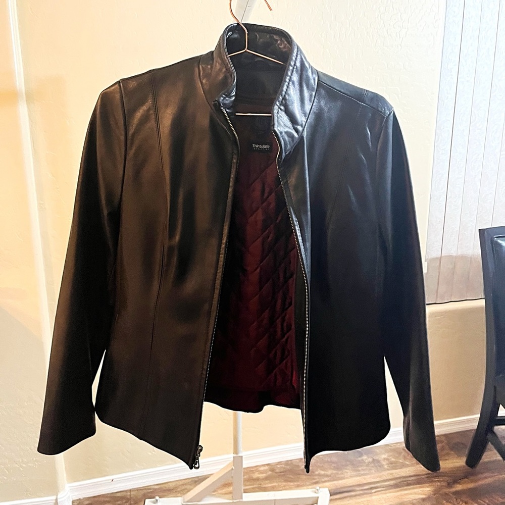 LW leather jacket and red material inside